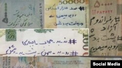 Indigenous Anangu children play with a camera during a ceremony marking the permanent ban on climbing Uluru, also known as Ayers Rock, at Uluru-Kata Tjuta National Park in Australia&#39;s Northern Territory.