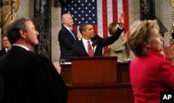 resident Barack Obama waves to First Lady Michelle Obama before 2009 speech to Congress.