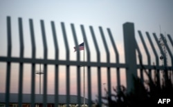 FILE - The American flag is pictured outside the Paso del Norte Port of Entry in El Paso, Texas, April 7, 2018.