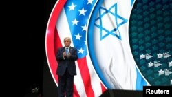U.S. President Donald Trump bids farewell to the audience after delivering remarks at the Israeli American Council National Summit in Hollywood, Florida, Dec. 7, 2019. 