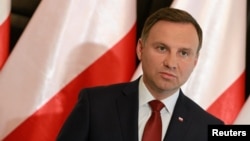 FILE - President Andrzej Duda speaks during a press conference in Warsaw, Poland.