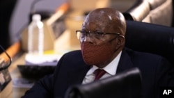 Former South African President Jacob Zuma appears at the hearing for his application for Deputy Chief Justice Raymond Zondo, to recuse himself from the state capture commission inquiry in Johannesburg, South Africa, Monday, Nov. 16, 2020. (AP Photo…