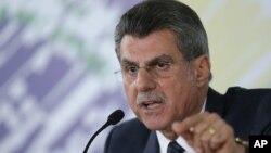Brazilian Planning Minister Romero Juca talks to reporters about a leaked phone recording at his offices in Brasilia, Brazil, May 23, 2016.