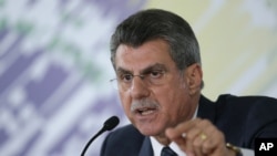 Brazilian Planning Minister Romero Juca talks to reporters about a leaked phone recording at his offices in Brasilia, Brazil, May 23, 2016.
