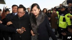 North Korean Hyon Song Wol, center, head of North Korea's art troupe, arrives at Gangneung Art Center in Gangneung, South Korea, Sunday. (Korea Pool Photo via AP)