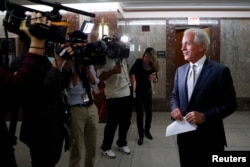 FILE - Sen. Bob Corker (R-TN) speaks with reporters after announcing his retirement at the conclusion of his term on Capitol Hill in Washington, Sept. 26, 2017.