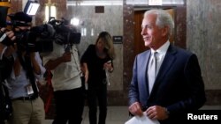 FILE - Sen. Bob Corker (R-TN) speaks with reporters after announcing his retirement at the conclusion of his term on Capitol Hill in Washington, Sept. 26, 2017.
