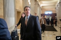 FILE - Michael Cohen, President Donald Trump's former lawyer, returns to Capitol Hill for a fourth day of testimony as Democrats pursue a flurry of investigations into Trump's White House, businesses and presidential campaign, in Washington, March 6, 2019.