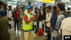This handout picture from Rwanda's Ministry of Emergency Management taken Sept. 26, 2019, shows the arrival of refugees and asylum seekers from Libya at the Kigali international airport in Kigali, Rwanda.