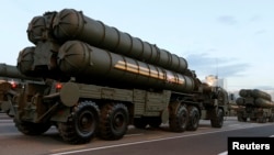 FILE - Russian S-400 air defense mobile missile launching systems are seen in Minsk, July 3, 2014. 