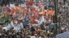 Participants march with flags and placards during an anti-government protest in Moscow, June 12, 2012. 