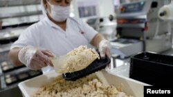 An employer packs vegan chicken, that has no meat in it, at Superbom factory in Sao Paulo, Brazil June 19, 2019. (REUTERS/Nacho Doce)