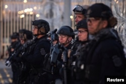 U.S. Customs and Border Protection (CBP) Special Response Team (SRT) officers stand guard at the San Ysidro Port of Entry after the land border crossing was temporarily closed to traffic from Tijuana, Mexico, Nov. 19, 2018.
