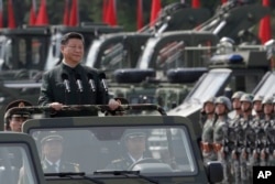 Chinese President Xi Jinping inspects Chinese troops of People's Liberation Army (PLA) Hong Kong Garrison at the Shek Kong Barracks in Hong Kong, June 30, 2017. Xi landed in Hong Kong Thursday to mark the 20th anniversary of Beijing taking control of the former British colony.