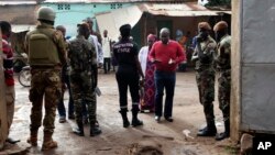 Security officers guard in front of a polling station during presidential elections, in Bamako, Mali, July 29, 2018.
