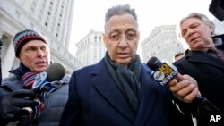 Former New York State Assembly Speaker Sheldon Silver, center, is surrounded by members of the media as he leaves a federal courthouse in New York, Feb. 24, 2015.