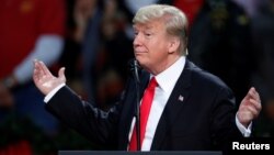 U.S. President Donald Trump speaks at a rally in Pensacola, Fla., Dec. 8, 2017.