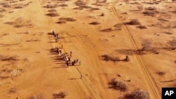 FILE - People arrive at a displacement camp on the outskirts of Dollow, Somalia on Septemer 21, 2022 amid a drought. (AP Photo/Jerome Delay, File)
