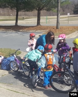 PedalPower Kids review the ABC's of bike maintenance before hitting the road. (F.Elmasry/VOA)
