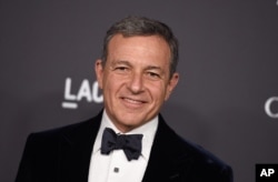 FILE - Disney CEO Bob Iger, pictured in October 2016 at a Los Angeles gala, has served in an advisory role for President Barack Obama and will do the same for Donald Trump when he assumes the presidency.