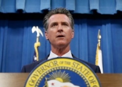 FILE - California Gov. Gavin Newsom addresses a news conference in Sacramento, Calif., July 23, 2019.