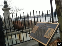 The plaque and bust of Alexander Hamilton mark the dueling grounds where Hamilton was fatally shot by Aaron Burr in 1804.