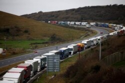 Freight trucks are seen queuing on A20 road into the Port of Dover, in Dover, Britain, Dec. 16, 2021.