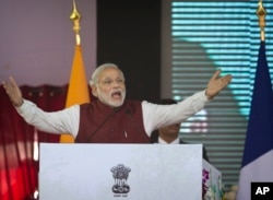 FILE - Indian Prime Minister Narendra Modi speaks during the foundation stone laying for the headquarters of the International Solar Alliance at Gurgaon, outskirts of New Delhi, India, Jan. 25, 2016.