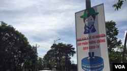 A poster in Phu Quoc, Vietnam, tells residents that filing health declarations is their contribution to the fight against COVID-19.