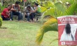 Relatives of murdered mayoral candidate Karina Garcia mourn in Suarez, Colombia, Sept. 2, 2019.