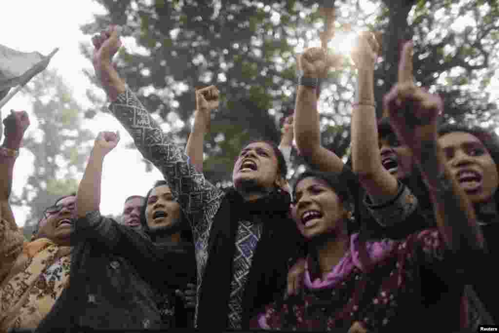 Garment workers and leaders shout slogans as they protest the deaths of their colleagues after a devastating fire in a garment factory in Dhaka, Bangladesh, November 27, 2012.