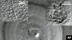 This undated image taken by the NASA Mars Reconnaissance Orbiter released by NASA/JPL-Caltech/University of Rome/Southwest Research Institute shows a recently discovered underground deposit of carbon dioxide ice in the Martian south pole