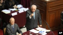 Peru's President Pedro Pablo Kuczynski listens as his lawyer Alberto Borea addresses lawmakers of the opposition-ruled Congress, in Lima, Peru Dec. 21, 2017.