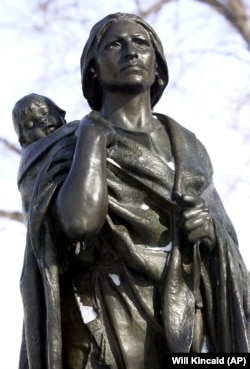 A statue of Sacagawea, an Indian translator for the Lewis and Clark expedition, is shown at the state Capitol in Bismark, North Dakota. (AP Photo/Will Kincaid)