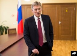 FILE - President Vladimir Putin’s spokesman Dmitry Peskov speaks to a reporter in Moscow.