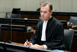 Prosecutor Norman Farrell, attends a session of the United Nations-backed Lebanon Tribunal in Leidschendam, Netherlands, Aug. 18, 2020.