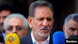 FILE - Iranian Vice President Eshaq Jahangiri speaks during a news conference, in Najaf, Iraq, Feb. 18, 2015. Jahangiri said Sunday that Iran will allow private companies to export crude oil in an attempt to defeat U.S. sanctions.