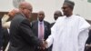 South Africa's President, Jacob Zuma, left, is welcomed by Nigeria's President Muhammadu Buhari during an official visit at the Presidential Palace in Abuja, Nigeria, Tuesday, March 8, 2016.