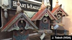 Artisan John Guertin combines his love of architecture and the environment by creating one-of-a-kind birdhouses and feeders using wood from century-old barns from his home state of Michigan.
