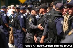 Police try to keep apart opposing groups of protesters in Public Square Wednesday, in Cleveland, July 20, 2016.