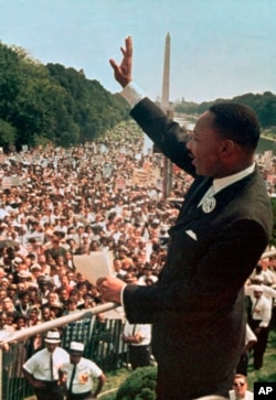FILE - Dr. Martin Luther King Jr. acknowledged the crowd at the Lincoln Memorial for his "I Have a Dream" speech during the March on Washington, Aug. 28, 1963.