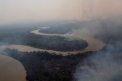 An aerial view shows smoke rising into the air around the Cuiaba river in the Pantanal, the world's largest wetland, in Pocone, Mato Grosso state, Brazil, August 28, 2020. REUTERS/Amanda Perobelli