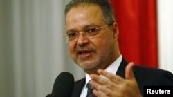 FILE - Yemeni Foreign Minister Abdel-Malek al-Mekhlafi speaks to the media after the Yemen peace talks in Switzerland in Bern, Dec. 20, 2015