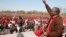 Leader of Zimbabwe's opposition party Movement For Democratic Change (MDC) Prime Minister Morgan Tsvangirai greets supporters at a rally in Harare, July 29, 2013.