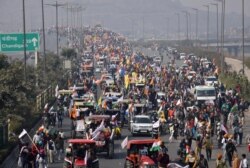 Farmers participate in a protest march towards the capital during India's Republic Day celebrations in New Delhi, India, Jan. 26, 2021.