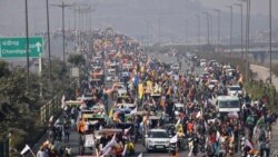 Farmers participate in a protest march towards the capital during India's Republic Day celebrations in New Delhi, India, Jan. 26, 2021.
