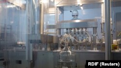 RUSSIA -- A specialist takes part in the production of "Gam-COVID-Vac" (Sputnik V) vaccine against the coronavirus disease (COVID-19), developed by the Gamaleya National Research Institute of Epidemiology and Microbiology and the Russian Direct Investment Fund (RDIF).