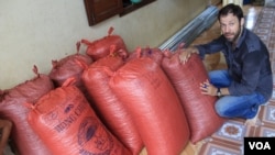 Vincent Mourou, co-owner of Marou, poses by bags of cocoa beans in southern Vietnam. (V. Marou)