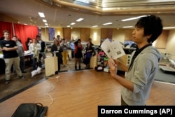 Shumpei Ushio of Japan speaks to a group of students gathered for the Cultural Coffee Hour that was hosted by the Japanese Student Association on the campus of Indiana University in Bloomington, Indiana. on November 9, 2012.
