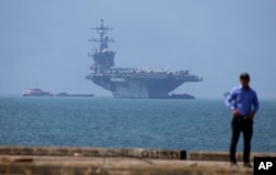FILE - The USS Carl Vinson is anchored at Tien Sa Port in Danang, Vietnam, March 5, 2018.